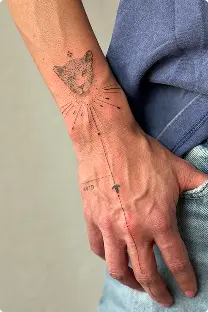 Fine-line constellation tattoo on the hand and wrist