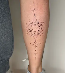 Geometric mandala line tattoo on the shin